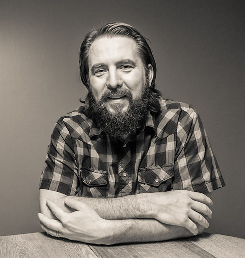 Joe Wilkins - Small Smile with Antique.jpg