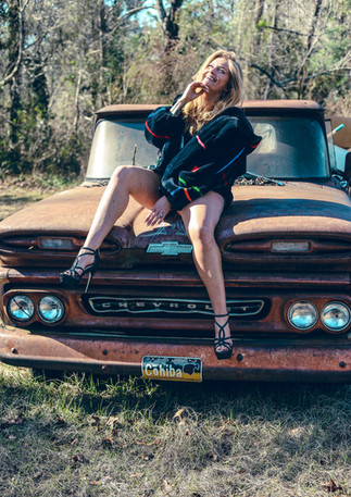 lady sitting on truck