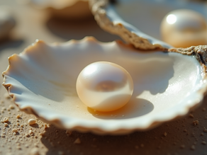 A close-up of a pearl resting on oyster shells, symbolizing beauty formed through irritation