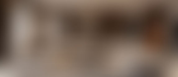 A cozy living room with natural textures and open layout representing a healthy, mindful home.