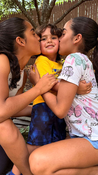 parents kissing toddler