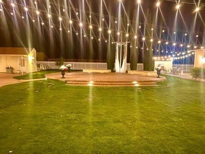 Vintage Nita outdoor area lit up at night