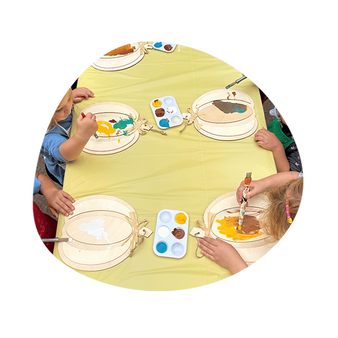 young kids doing craft at table