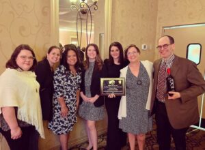 brain injury foundation of st. louis group photo of leadership and staff with award