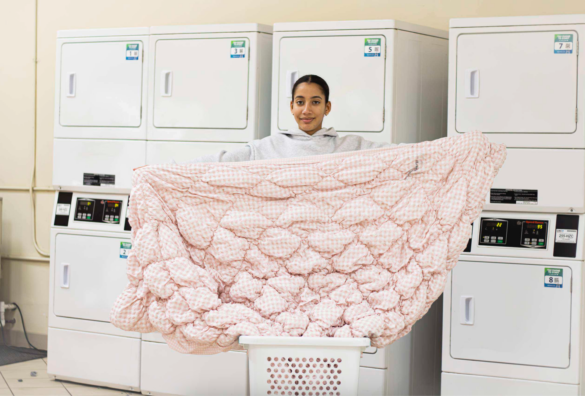 Laundry Day Gone Wrong: A Barry University student displays pink bedding reportedly stained after using campus washing machine. PHOTO CREDIT: MAISON CLEMENTE