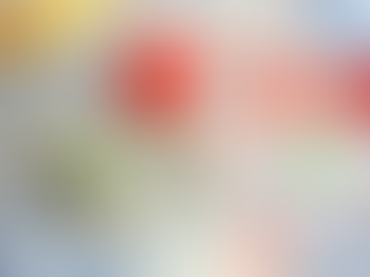 Cotton reels and buttons lie on a floral fabric background