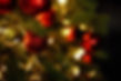 Close-up of Christmas tree with red balls and bokeh in the background Background with copy