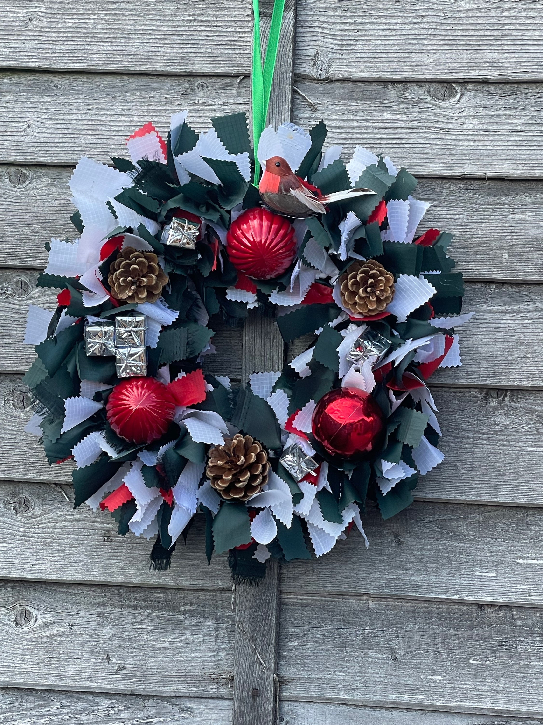 A fabric Christmas wreath outdoors