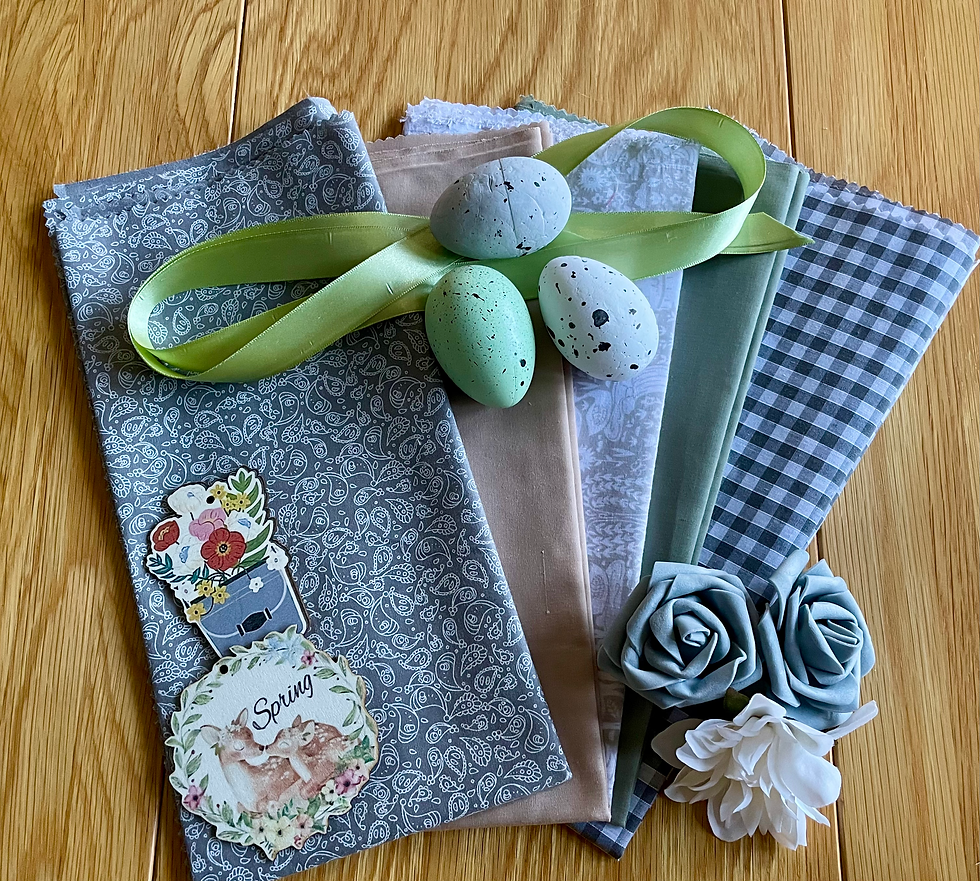 Thumbnail: A selection of fabrics with foam flowers and plastic coloured eggs