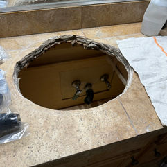 Bathroom vanity with an empty cutout for sink installation