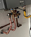 Plumber servicing a residential water heater system in Phoenix Arizona