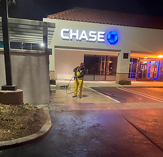 Heavy-duty commercial dumpster pad pressure washing, degreasing, and sanitization for a retail center in Cerritos, CA.