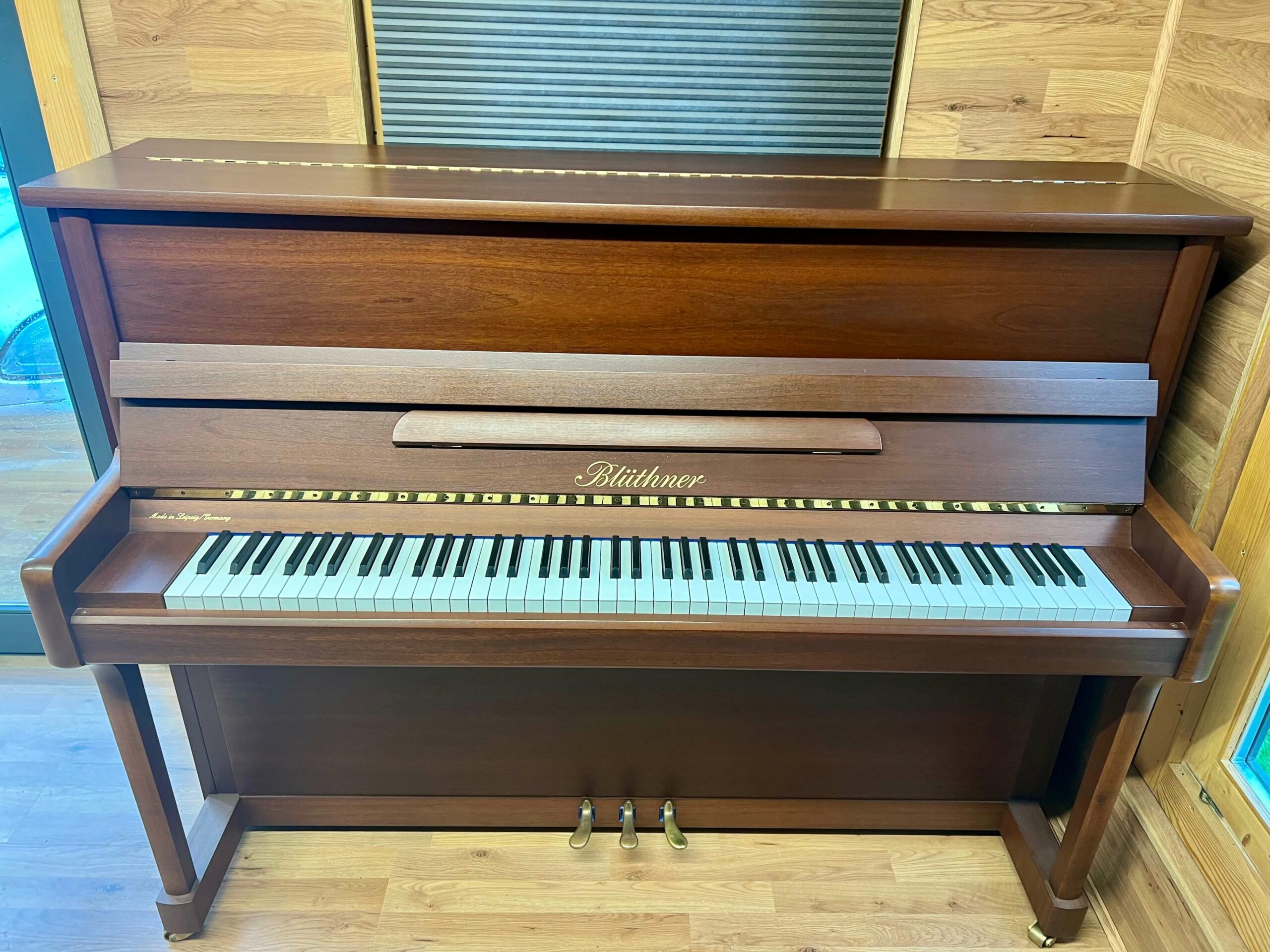 Bluthner Model C Upright Piano in natural mahogany