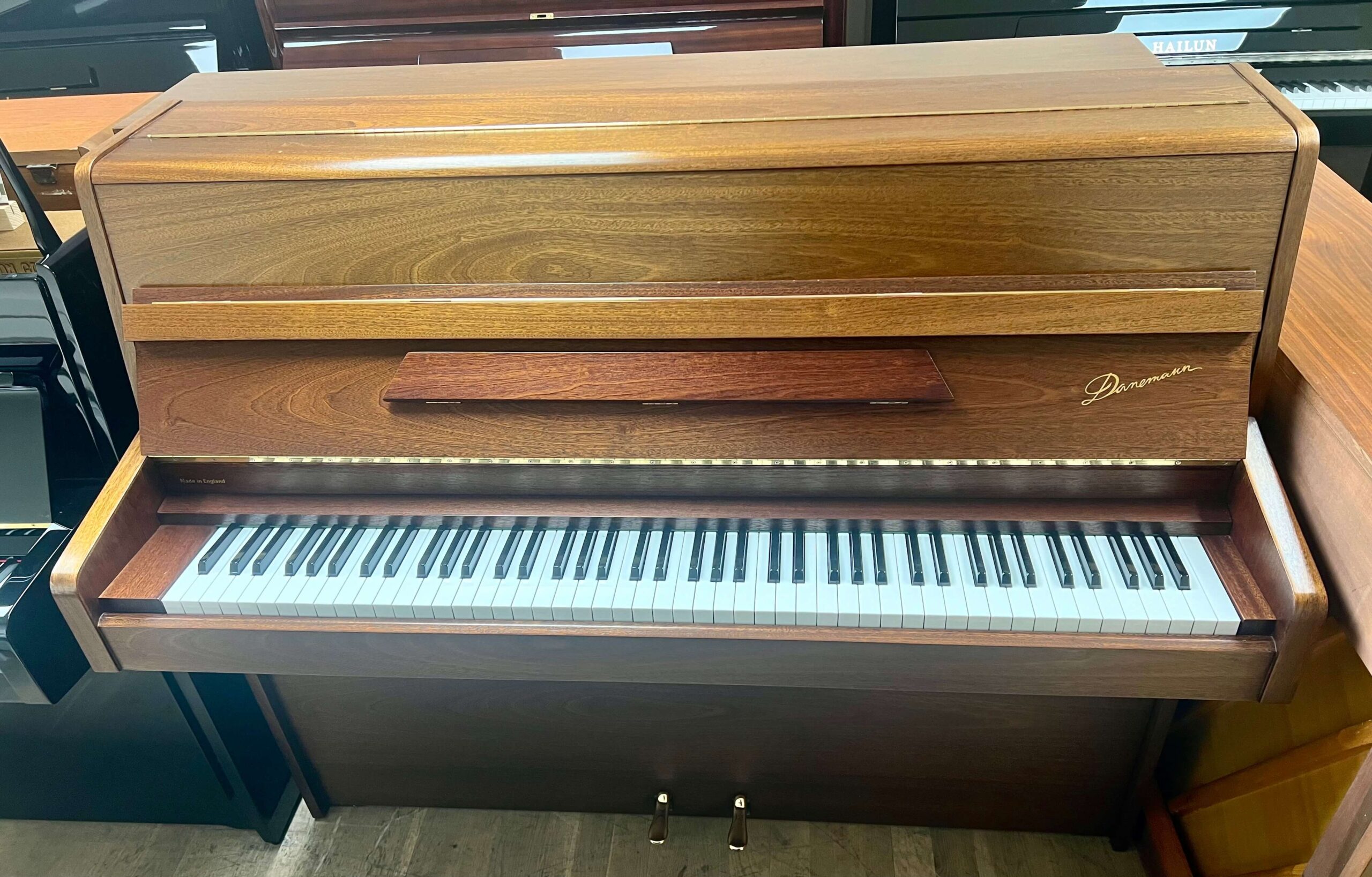 Danemann Upright Piano in natural mahogany with brass hardware