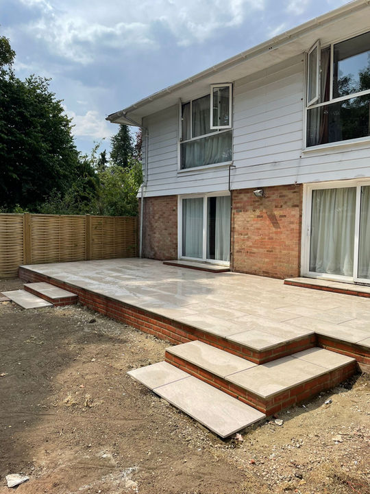 ACK Landscaping Full garden landscape job Basingstoke - Description - porcelain colour - mordina sand with pergolas and tegular paving alpha antique autumn gold Installation.