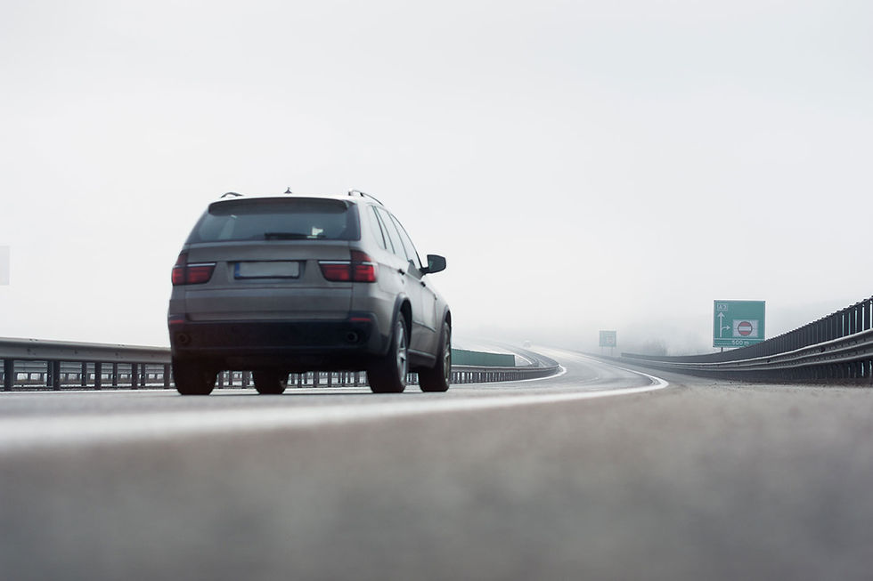 Anti-skid surfacing applied to road for improved traction and safety