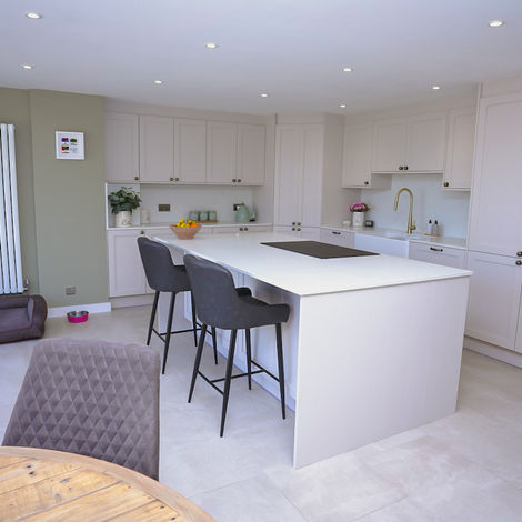 Bespoke shaker kitchen with a large breakfast island, integrated storage and neutral finishes