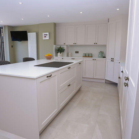 Open-plan shaker kitchen with large island and bifold doors
