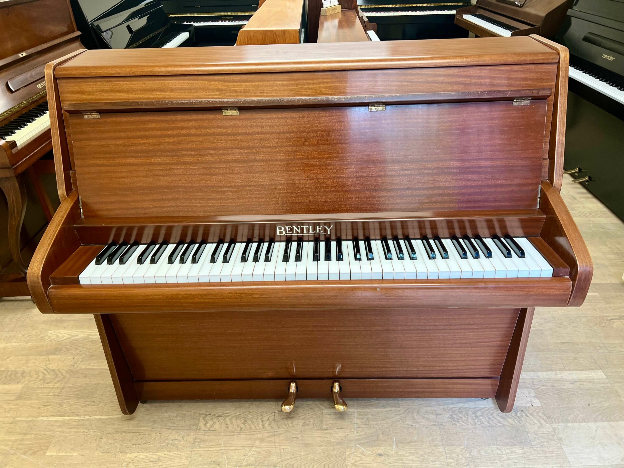 Bentley Six Octave Upright Piano in mahogany case with brass fittings