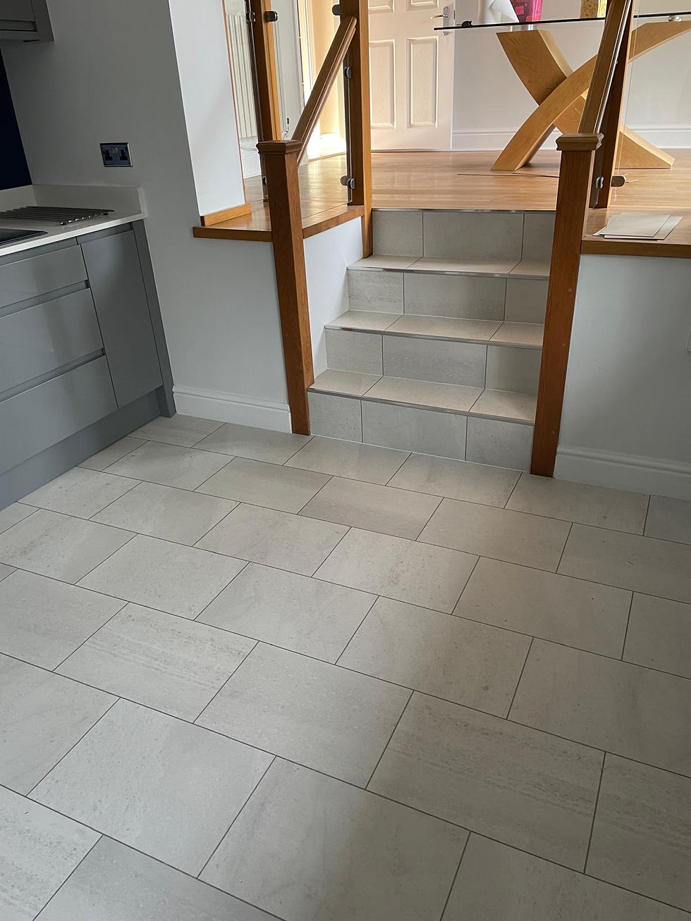 Laminate flooring with wood grain finish installed by Merit Flooring in Farnborough