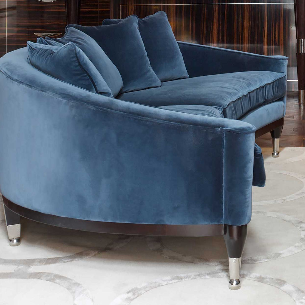The Eaton Sofa is a striking example of Art Deco- inspired design, featuring a dramatic, semicircular silhouette that creates