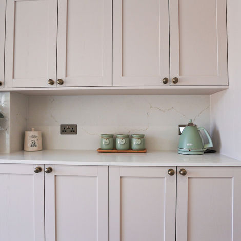Shaker kitchen pantry storage with quartz splashback and neutral cabinetry