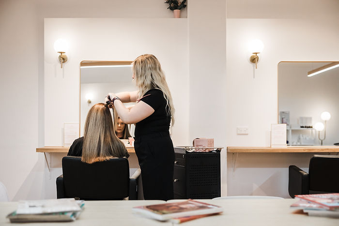 Close-up view of a stylist shaping a layered haircut