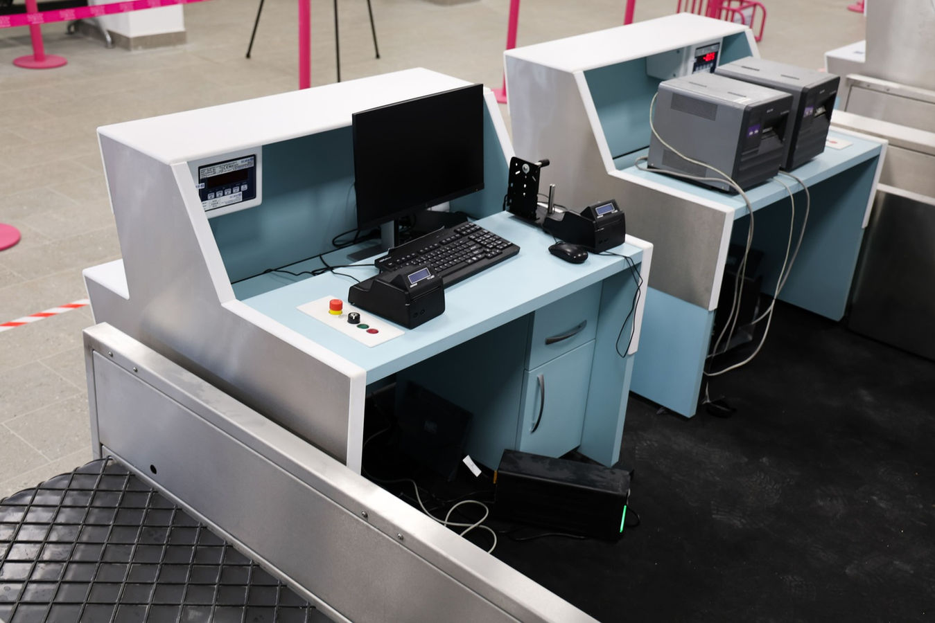 airport check-in desk with integrated baggage conveyor system