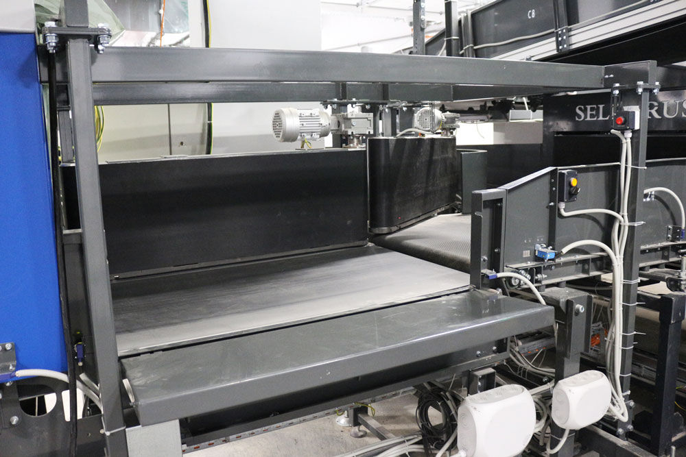 automated baggage conveyor system in airport terminal
