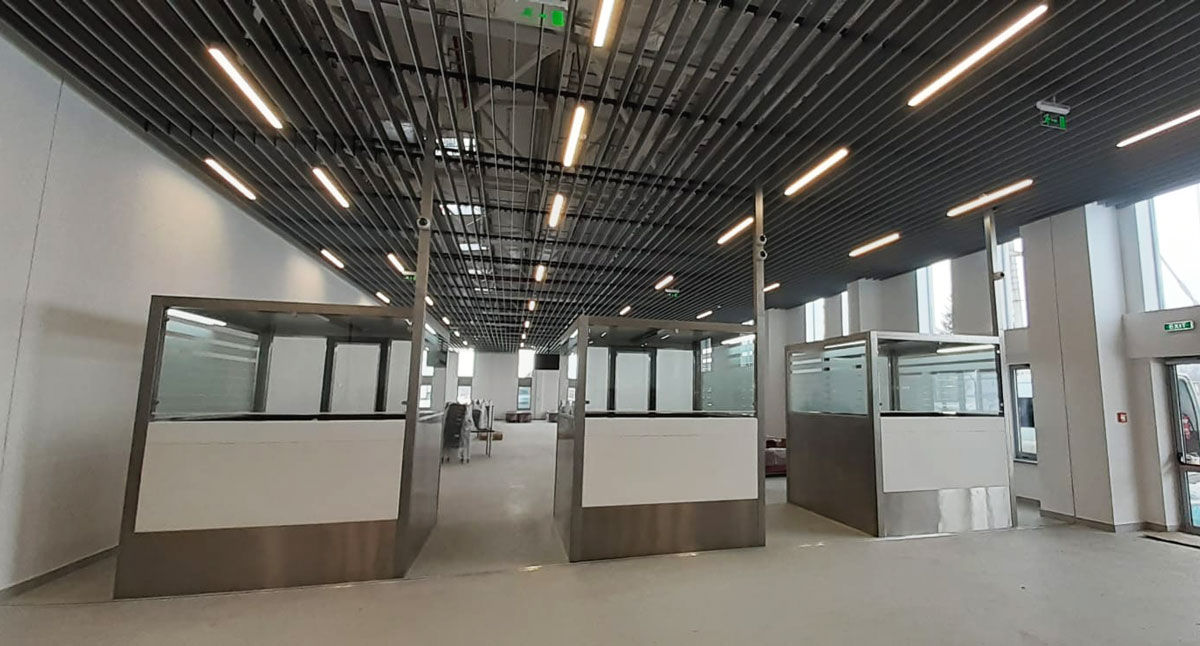 durable immigration desks operated by staff at an airport passport control checkpoint