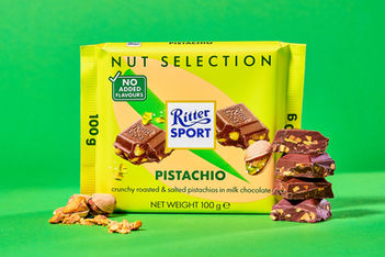 Ritter sport pistachio chocolate food photography, set on green infinite backdrop, styled with broken pistachio nuts and a stack of chocolate pieces, commercial food photography north Yorkshire