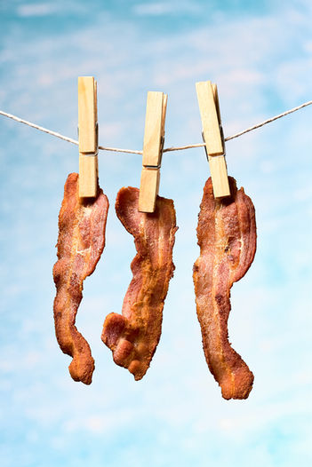 crispy bacon hanging with a peg on a washing line