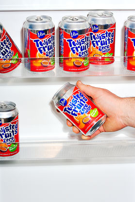 commercial drink photography of twisted fruit cans in fridge door, harrogate