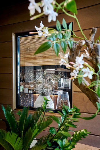 detail photo of hotel interior window with flowers around