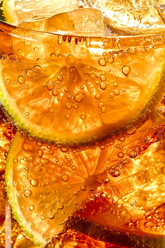 commercial drink macro photography  of lime and ice with cola in a glass, North Yorkshire 