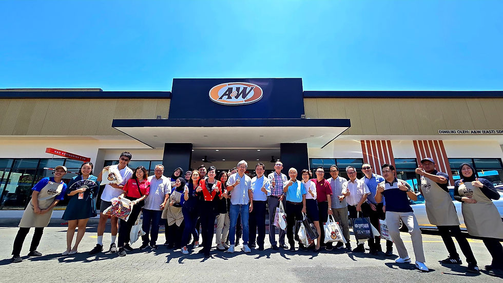 Wong (13th right), Chen (12th right) and guests at the launch of A&W’s first drive-thru and drive-in outlet at Parklane City Benoni.