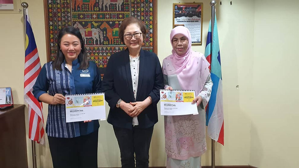 Photo shows Liew (centre) with Dr Rosmawati (right) and SICC Assistant Director of Corporate Communications, Clara Lim (left) displaying their promotional material.