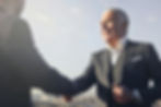 christian financial advisor shaking the hand of a client