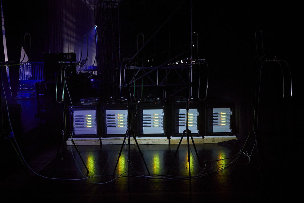 RF language distribution setup with FM transmitters and broadcast antennas positioned for clean audio coverage across a multilingual event venue.