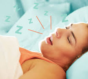 Adult sleeping with mouth open, depicting mouth breathing and snoring, key signs of airway issues addressed through myofuncti