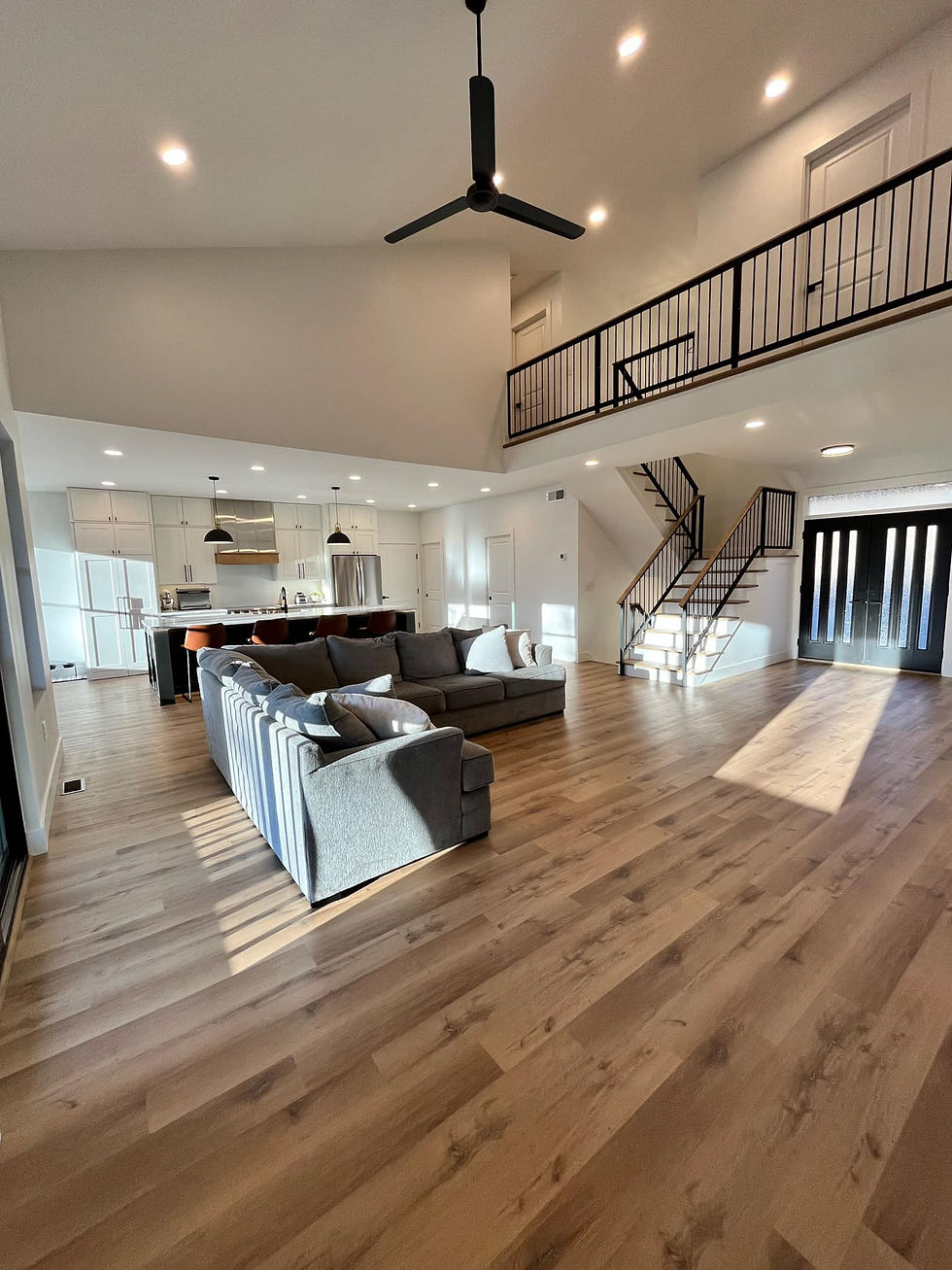 Modern two-story home interior with hardwood floors
