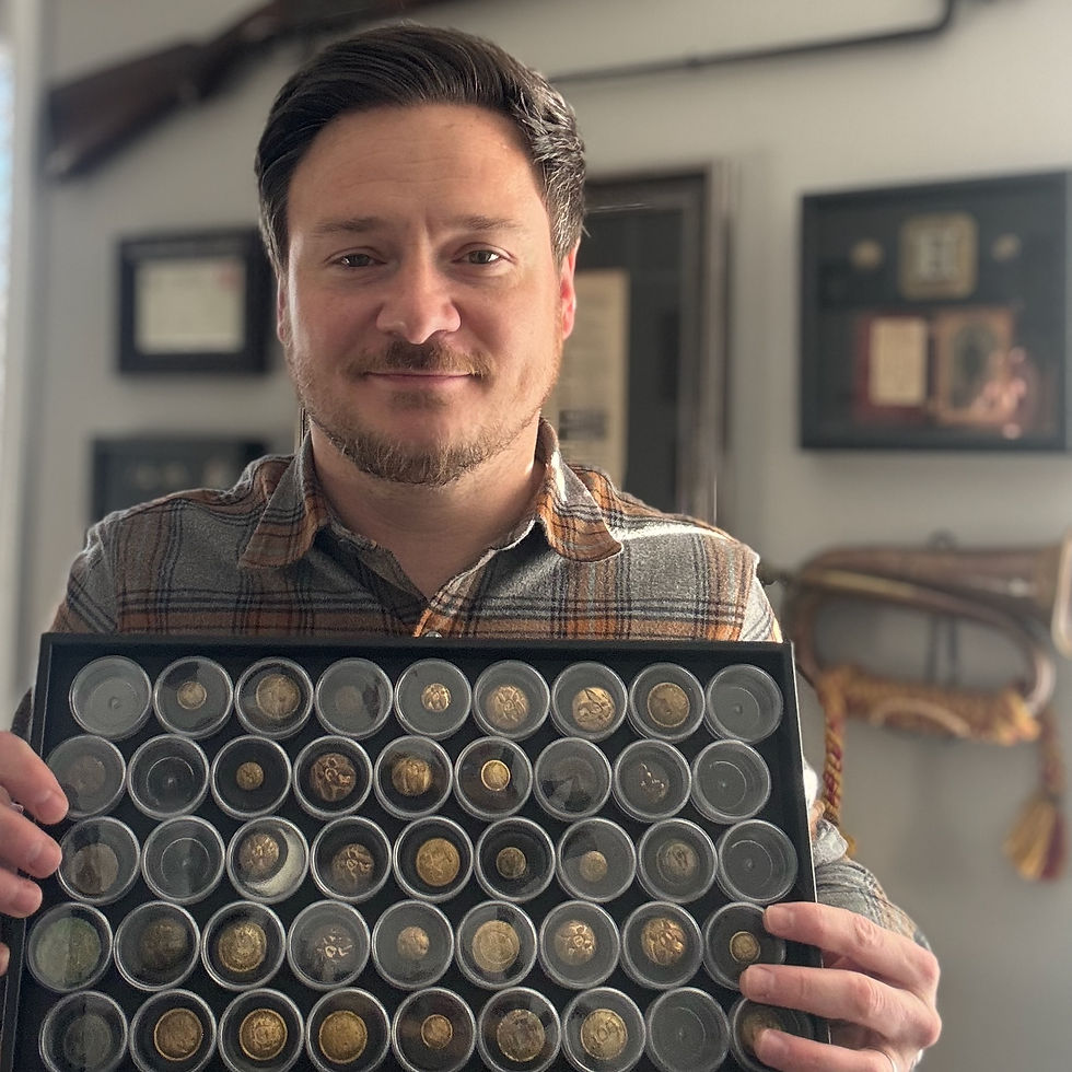Heith Hart holding his collection of buttons with Canfield Bro
backmarks.