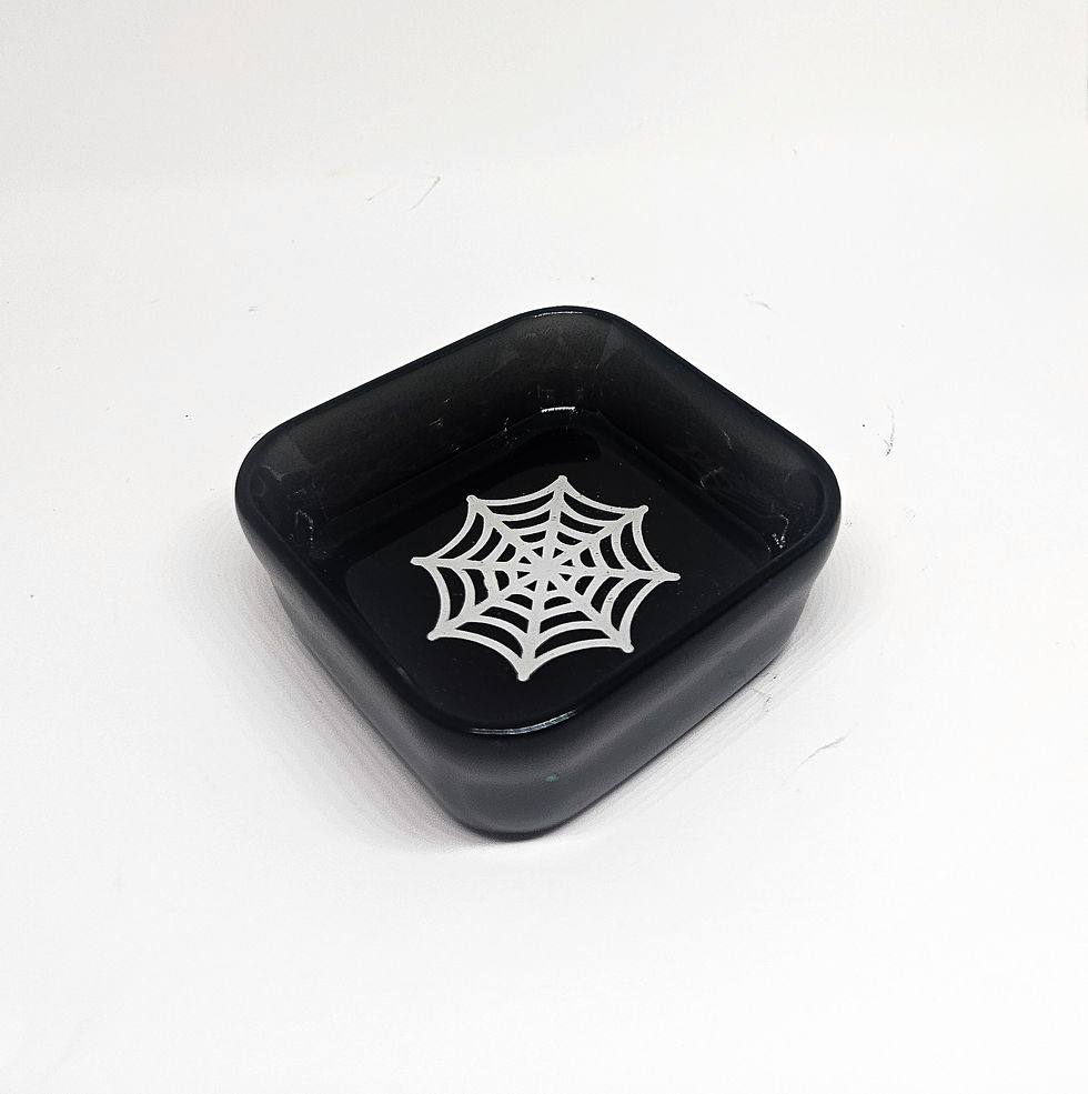 black square resin trinket dish with white spider web graphic