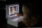 A woman using a booth in a box at a party