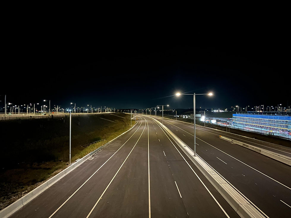 Wide landscape night photo of an empty multi-lane highway