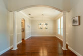 Empty dining room with wood floors and arched doorway, Dallas TX remodel