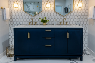 Navy blue bathroom vanity with brass hardware, luxury remodel Dallas TX