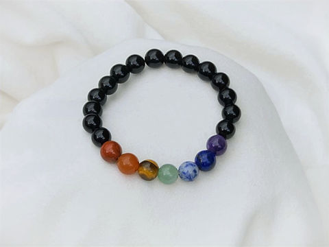 Black beaded bracelet with seven colorful chakra stones
