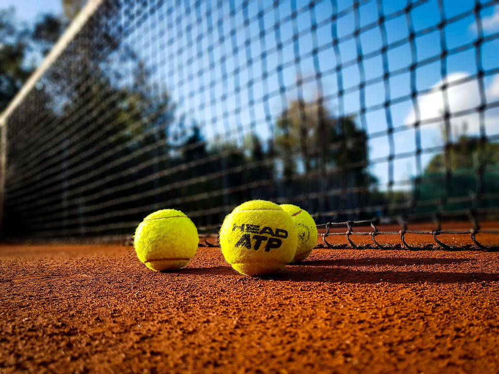 head atp tennis balls on clay court
