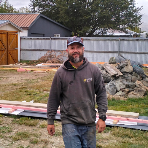 Trusted local builder smiling on a construction site